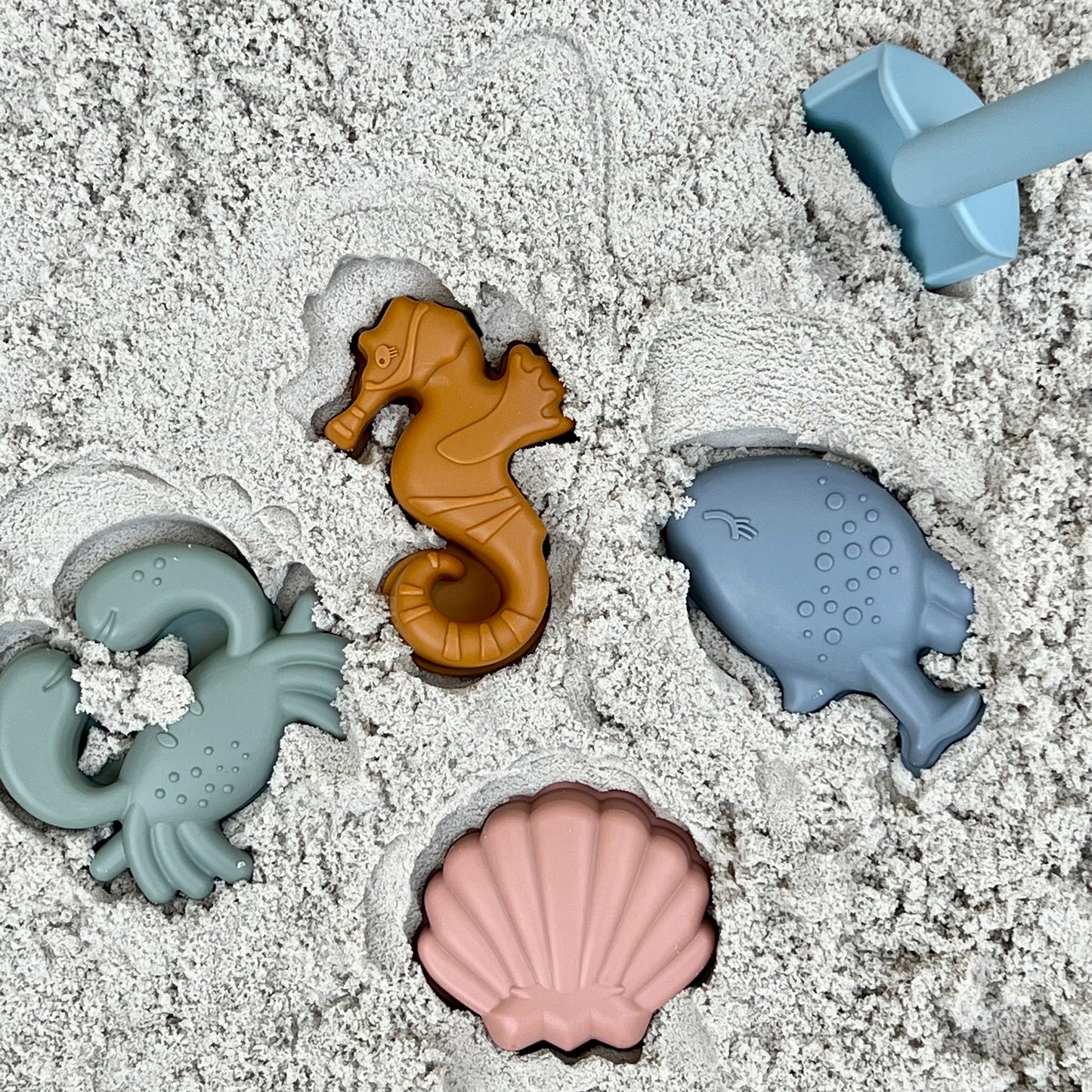 Beach bucket with sand molds