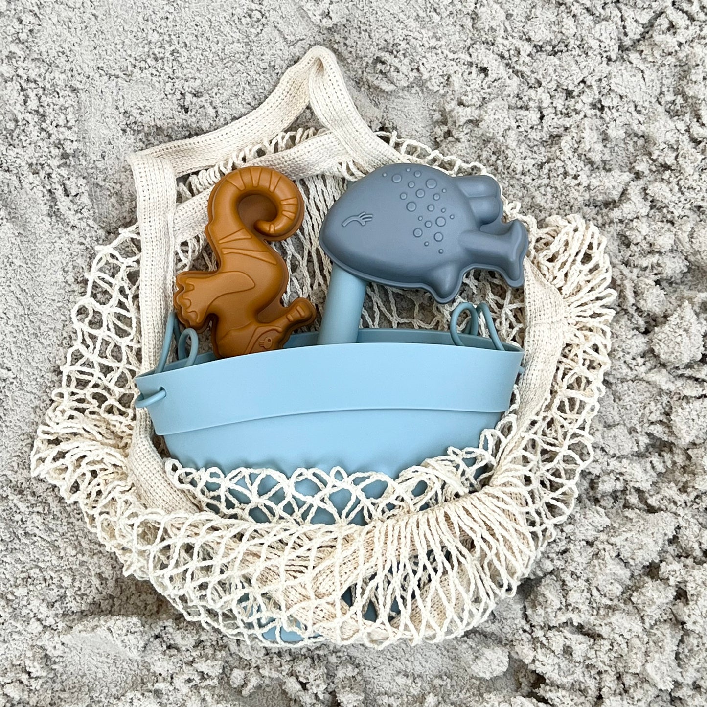 Beach bucket with sand molds